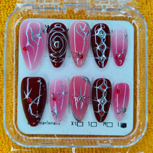 Y2K Cyberpunk red & pink stiletto press-on nails, size L, with silver line art & red rhinestones.
